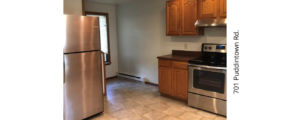 a kitchen with stainless steel appliances and wooden cabinets