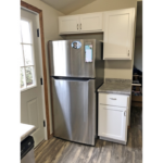 a stainless steel refrigerator freezer sitting in a kitchen