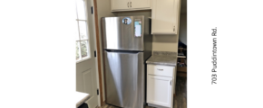 a stainless steel refrigerator freezer sitting in a kitchen