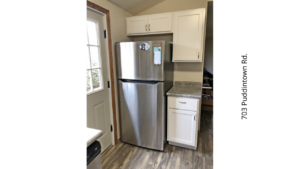 a stainless steel refrigerator freezer sitting in a kitchen