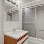 a bathroom with a sink, toilet and bathtub