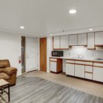 a living room and kitchen area in an apartment