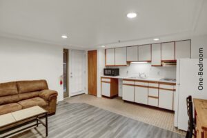 a living room and kitchen area in an apartment