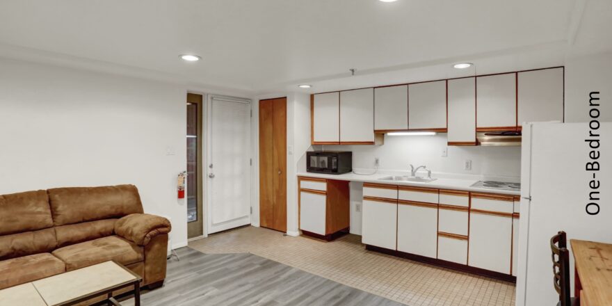 a living room and kitchen area in an apartment