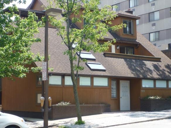 a car is parked in front of a house