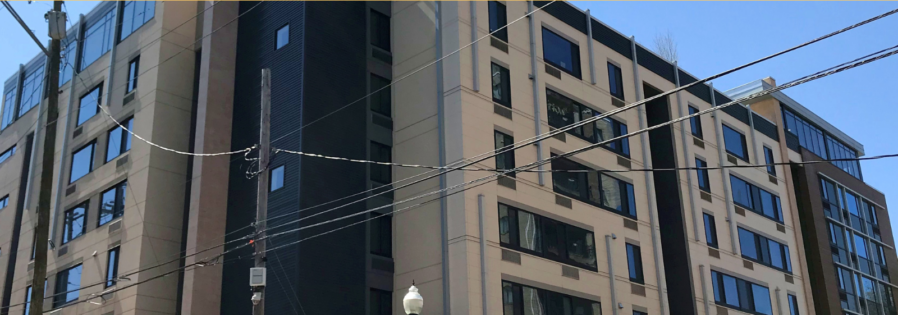 an apartment building with the words apply now for 205 - 2077