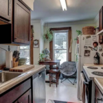 upstairs unit kitchen with a sink, stove and refrigerator