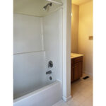 a bathroom with a bathtub and sink in it