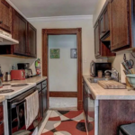 upstairs unit kitchen with wooden cabinets