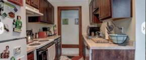 upstairs unit kitchen with wooden cabinets