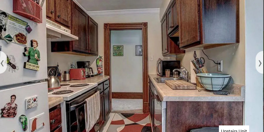 upstairs unit kitchen with wooden cabinets