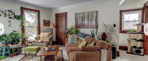 a living room filled with furniture and lots of windows