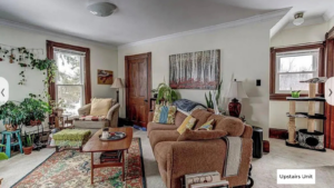 a living room filled with furniture and lots of windows