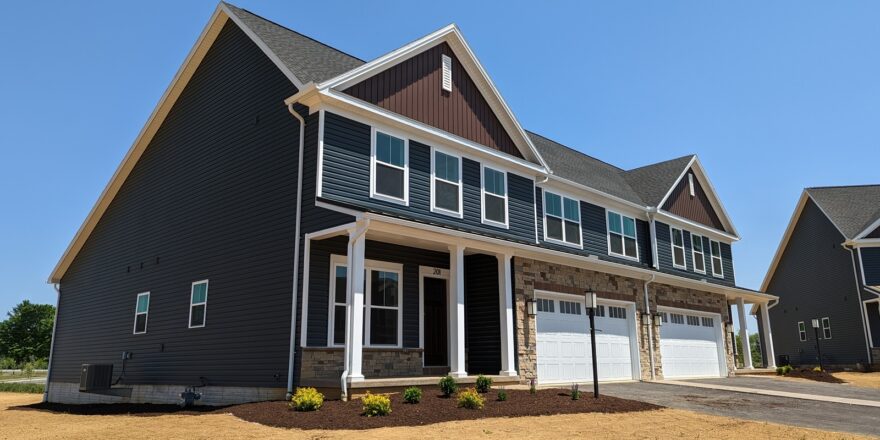 a row of houses with a two-car garage on each side