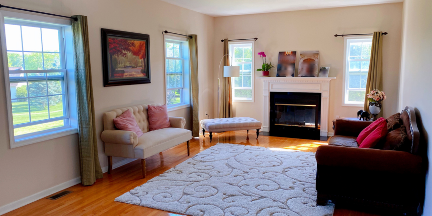 a living room filled with furniture and a decorative fire place
