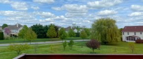 a view of a neighborhood from a deck