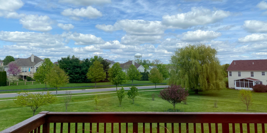 a view of a neighborhood from a deck