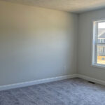 an empty room with a large window in it