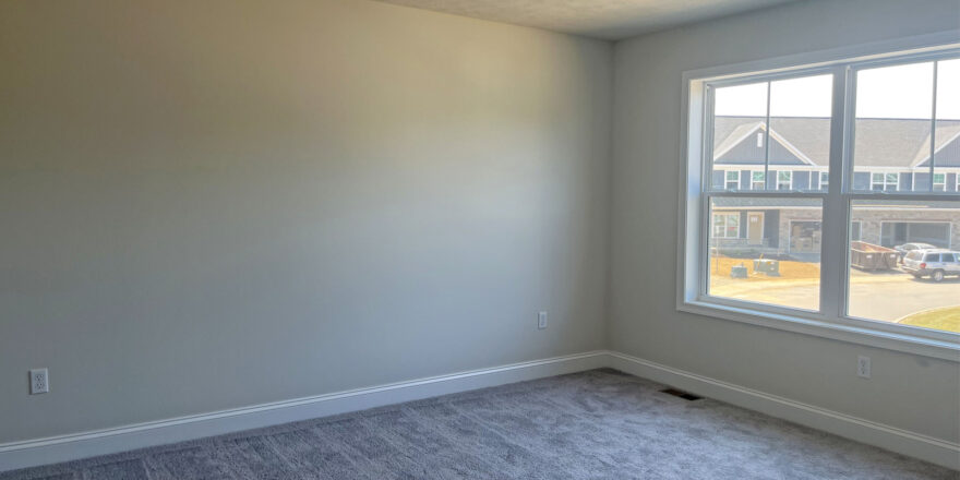 an empty room with a large window in it