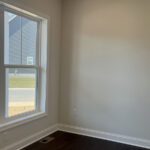 an empty room with a large window in it