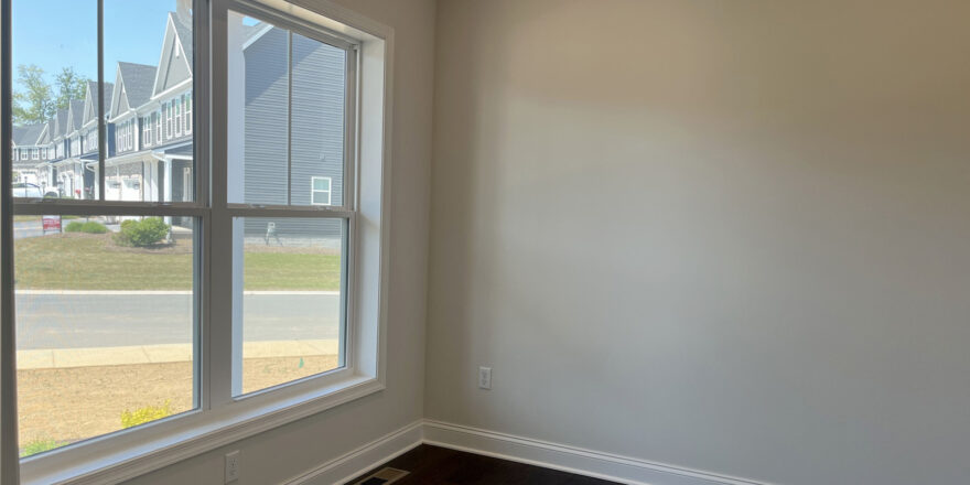 an empty room with a large window in it