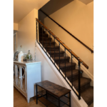 a stair case next to a white wooden cabinet
