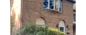 a brick house with a window and door