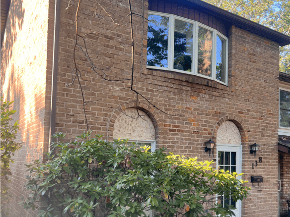 a brick house with a window and door