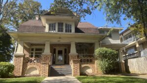 a brick house with a large front porch