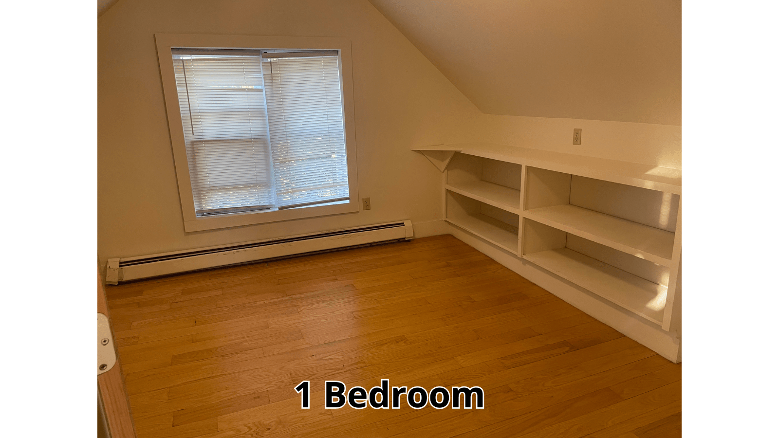 Attic bedroom with built-in shelves