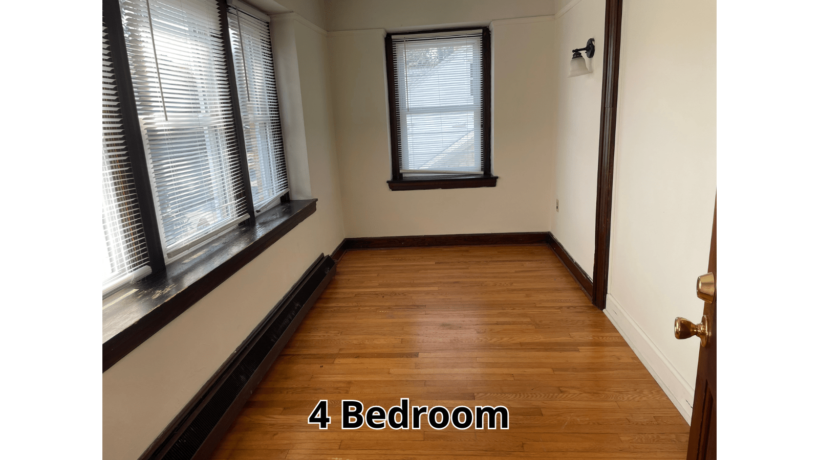 Empty room with hardwood floors and windows
