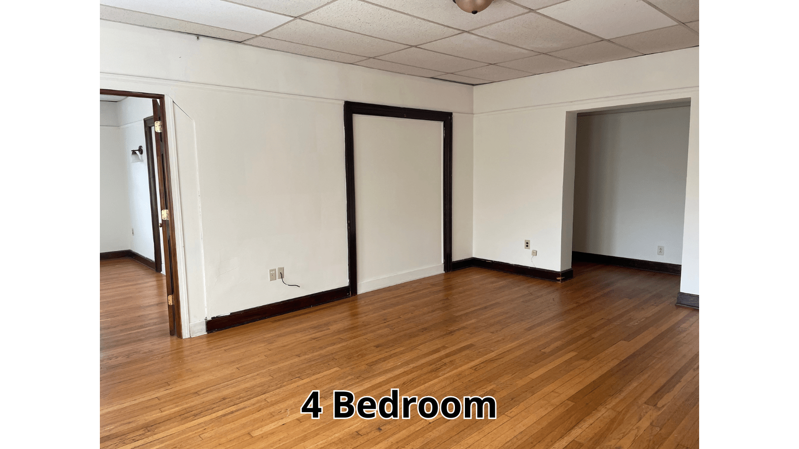 Empty living room with hardwood floors