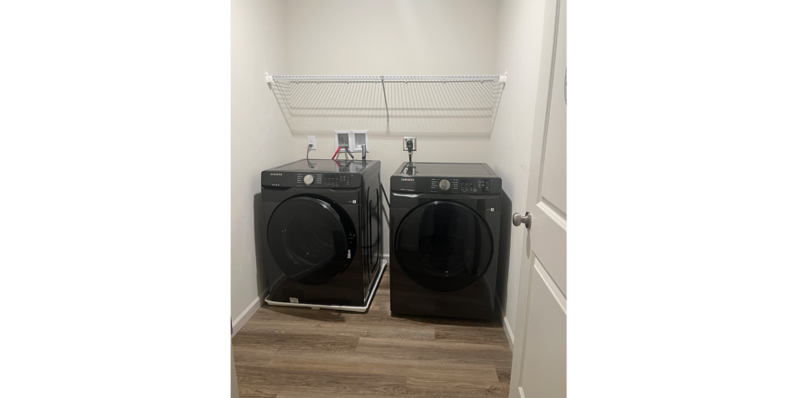 a washer and dryer in a small room