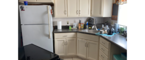 a white refrigerator freezer sitting inside of a kitchen