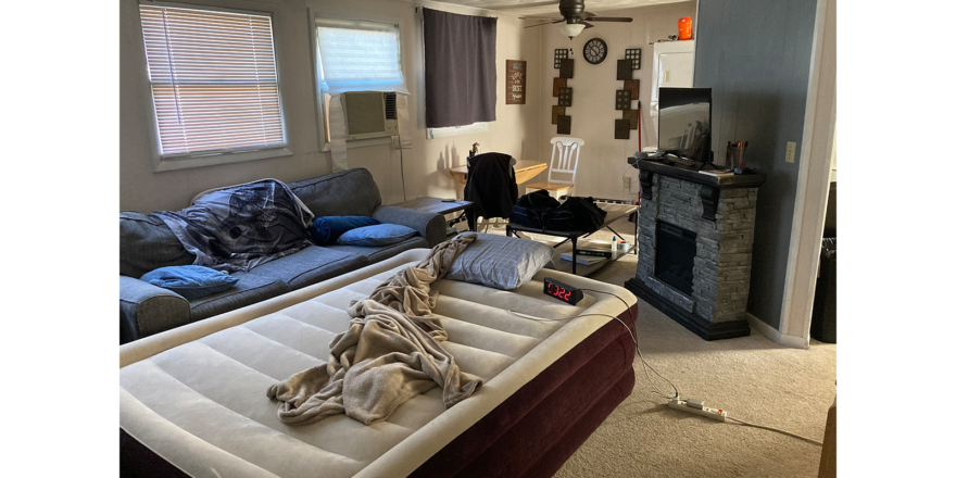 a living room filled with furniture and a fire place