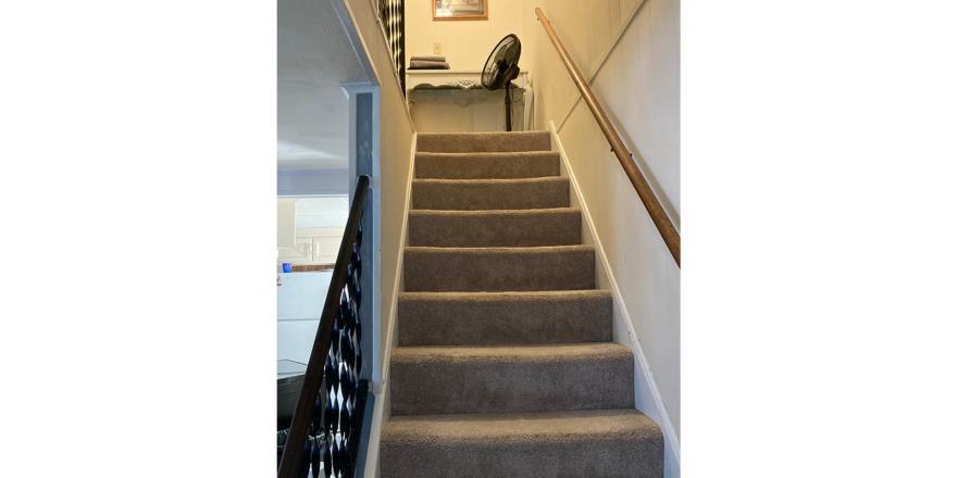 a set of stairs leading up to a hallway