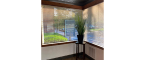 a common area with a window with blinds