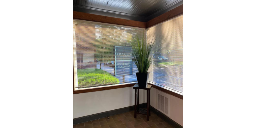 a common area with a window with blinds