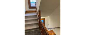 the building staircase leading up to a window in a building