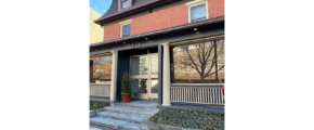 the front entrance to a two story brick building