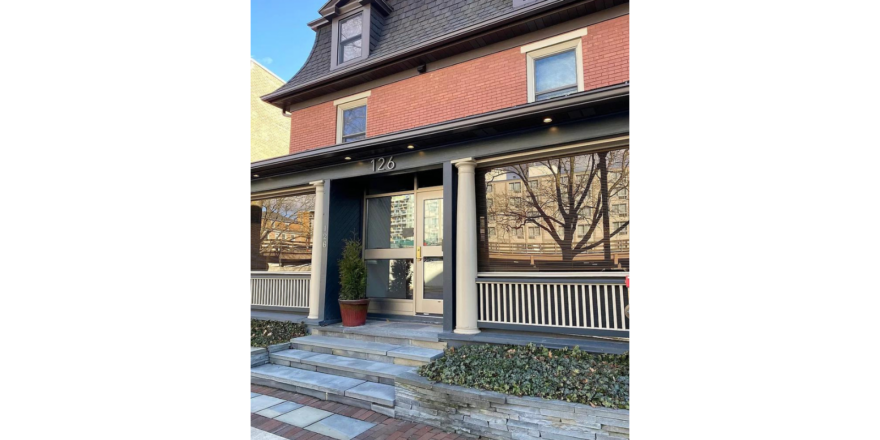 the front entrance to a two story brick building