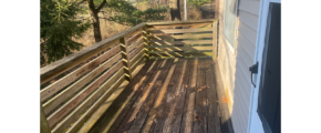 a wooden deck behind the townhouse