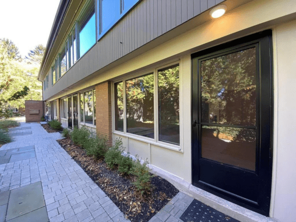 a building with a black door and windows