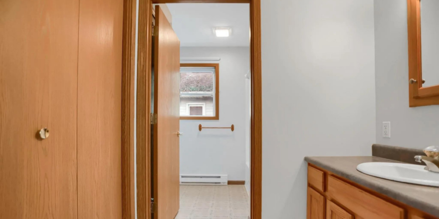 a bathroom with a sink and a mirror