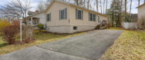a house with a driveway in front of it