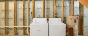 a dryer and dryer in a room under construction