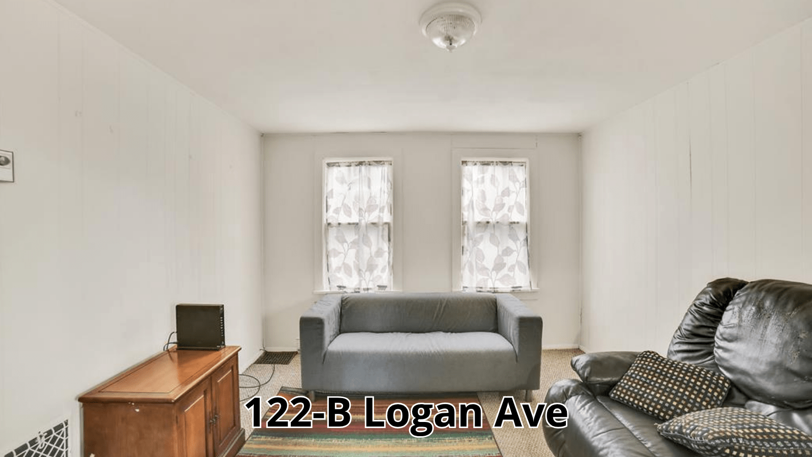 Living room with couch and windows