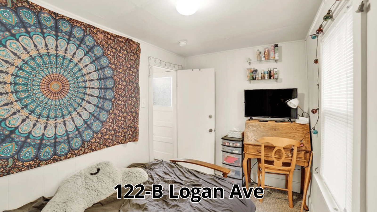 Bedroom with mandala tapestry and desk