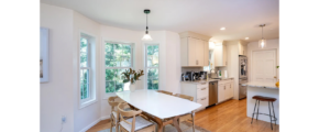 a kitchen with a table and chairs in it
