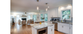 a large kitchen with a center island in the middle of the room